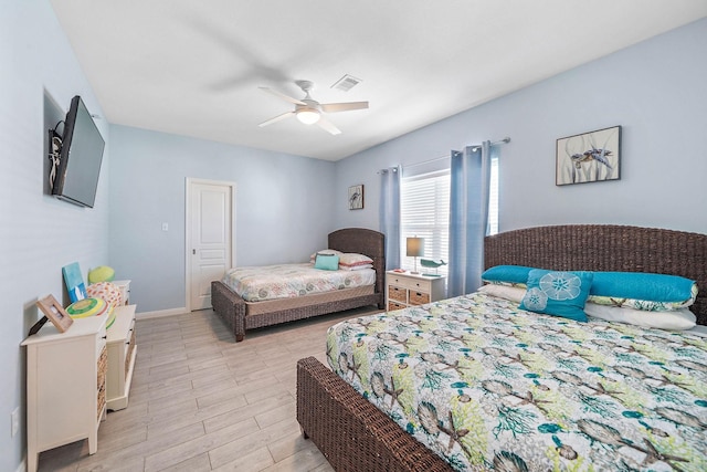 bedroom with ceiling fan and light hardwood / wood-style flooring