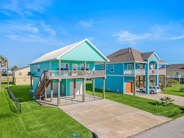 rear view of property with a yard and a garage