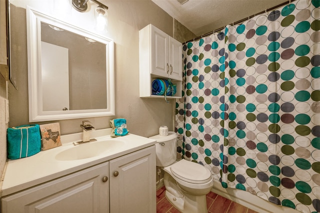 full bathroom with vanity, toilet, shower / bath combo, a textured ceiling, and hardwood / wood-style floors