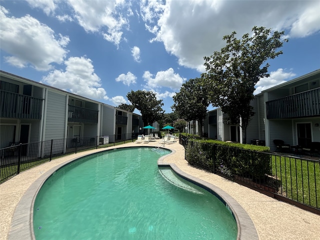 view of swimming pool featuring a patio