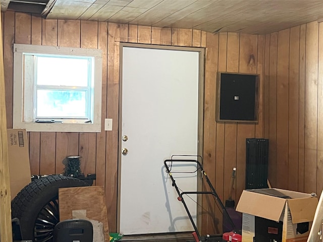 entryway with wood walls and wood ceiling