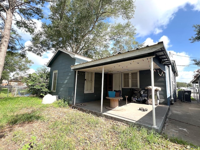 rear view of property featuring a patio area