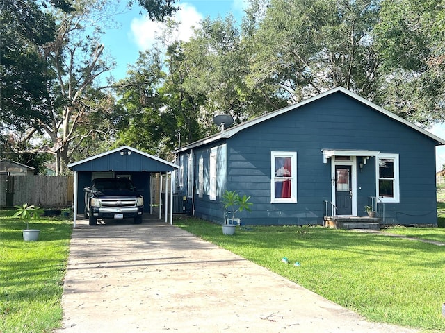 bungalow-style house with a front yard and a carport