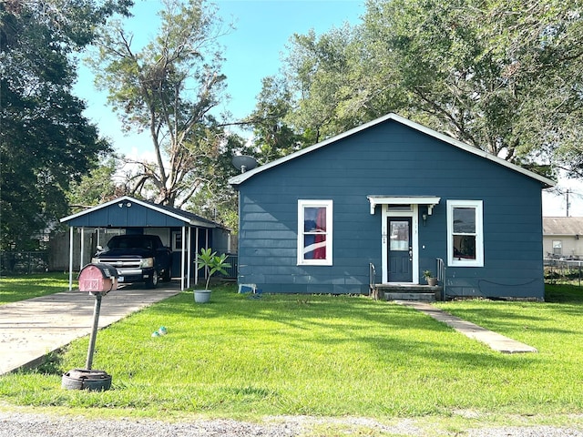 bungalow-style home with a front lawn and a carport