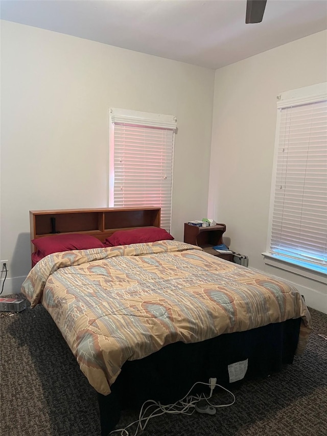 bedroom featuring ceiling fan and carpet floors