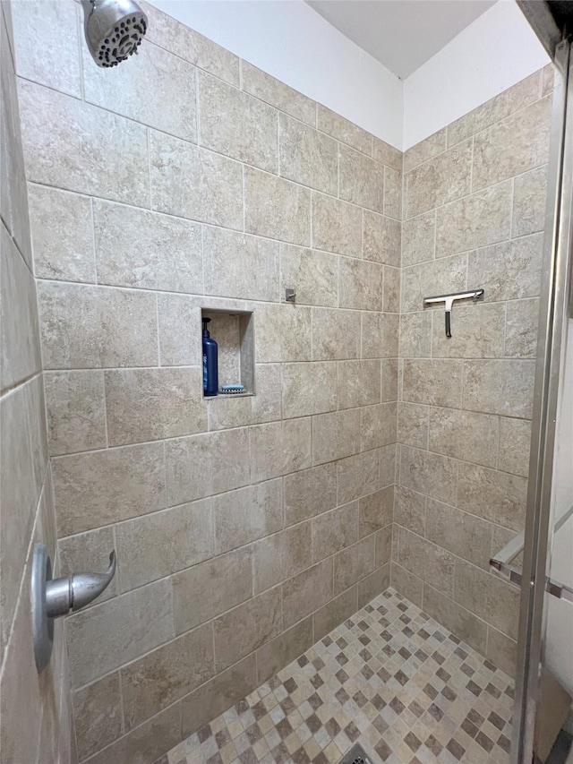 bathroom with tiled shower