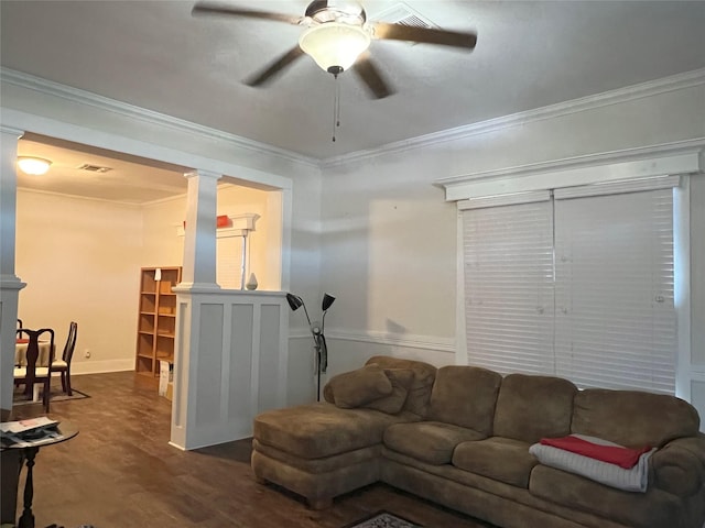 living room with decorative columns, ceiling fan, hardwood / wood-style floors, and ornamental molding