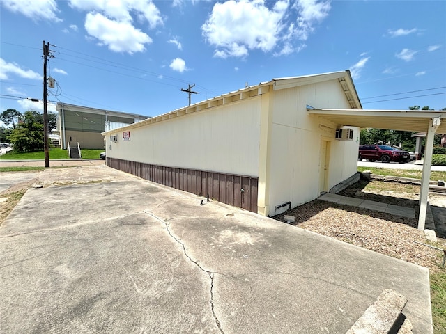 view of property exterior featuring a carport