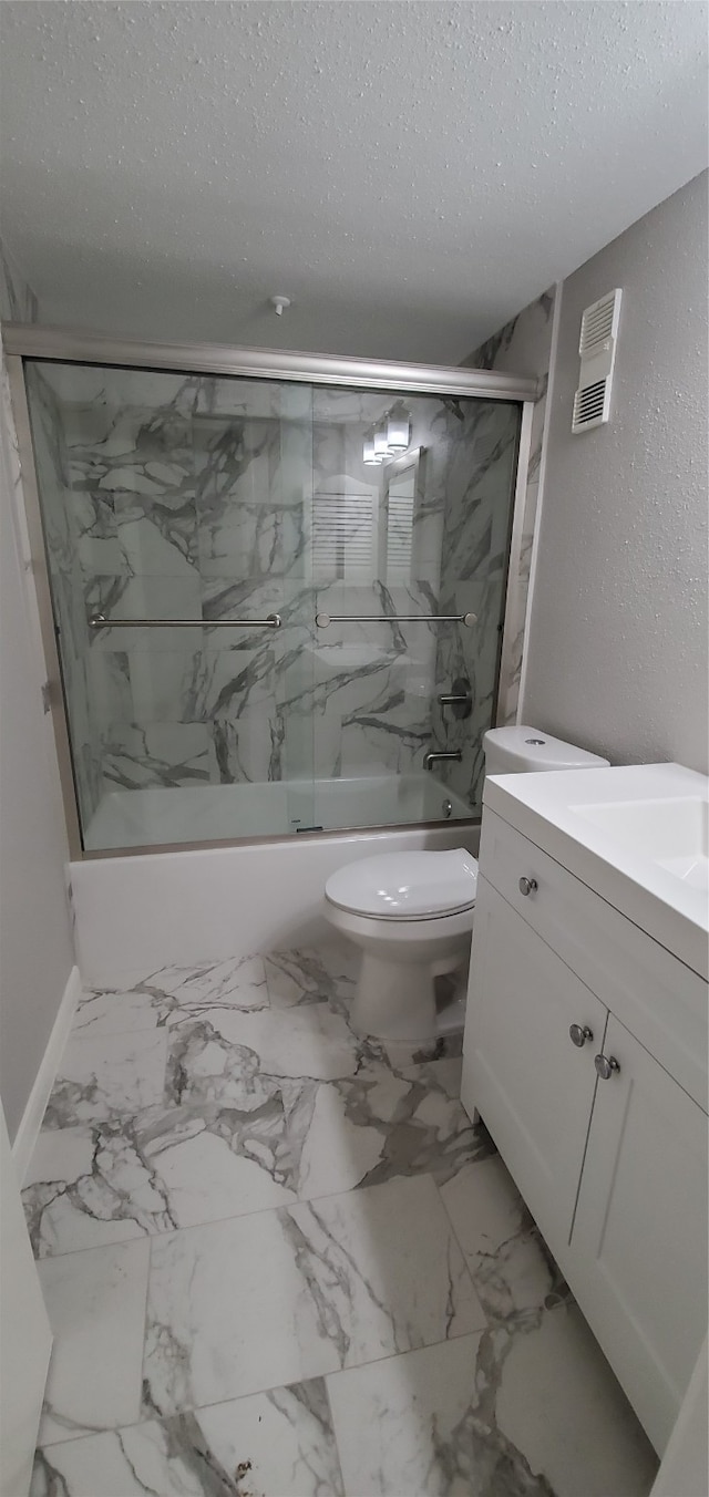 full bathroom featuring vanity, toilet, enclosed tub / shower combo, and a textured ceiling