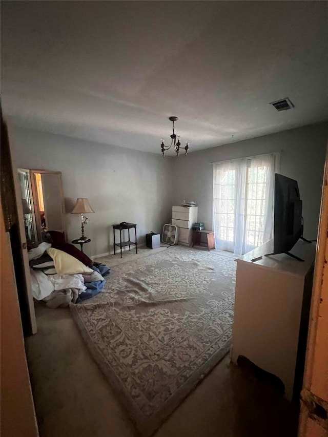 bedroom with a chandelier and carpet flooring