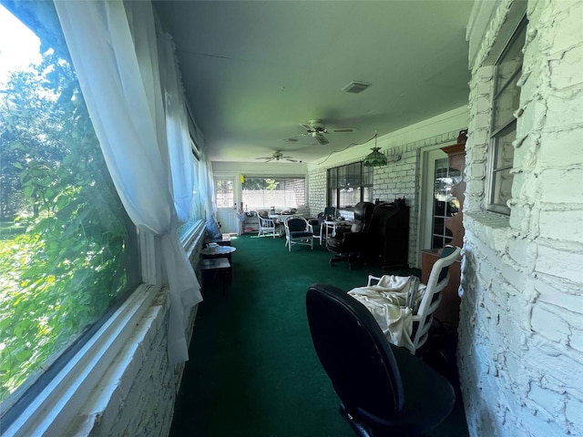 sunroom / solarium with ceiling fan