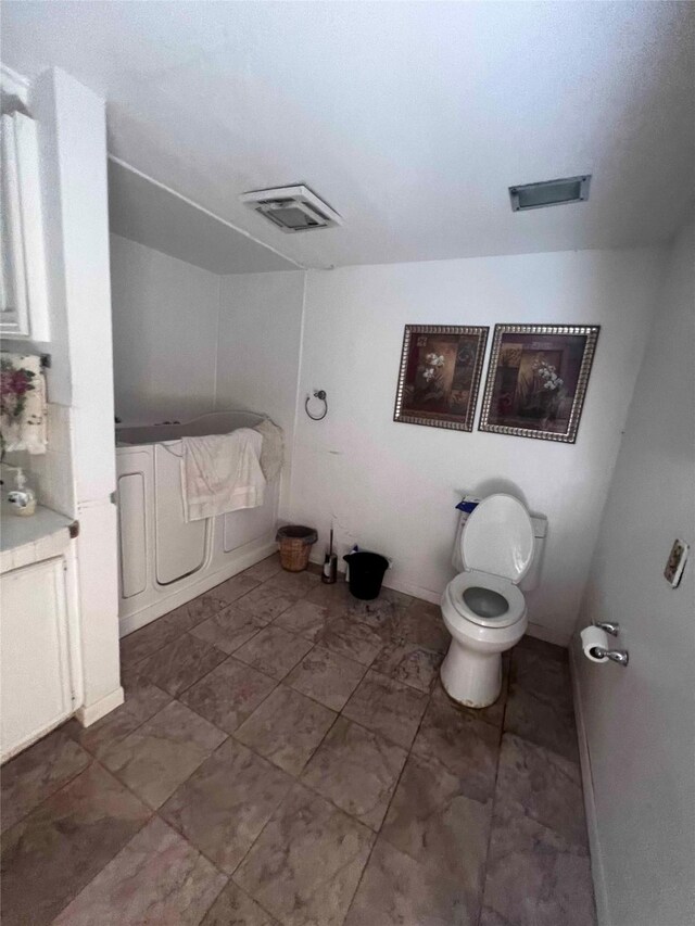 bathroom featuring toilet