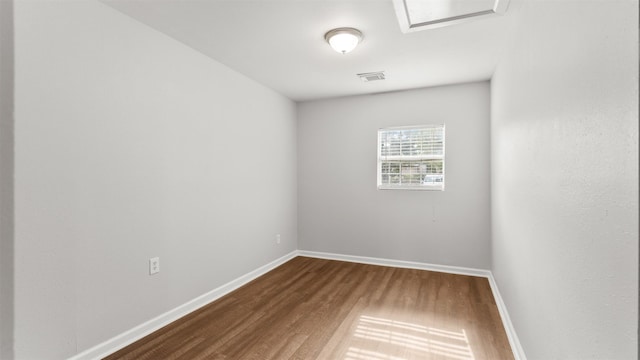 empty room with wood-type flooring