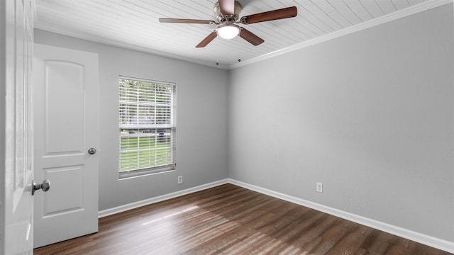 empty room featuring dark wood-type flooring, ceiling fan, and ornamental molding