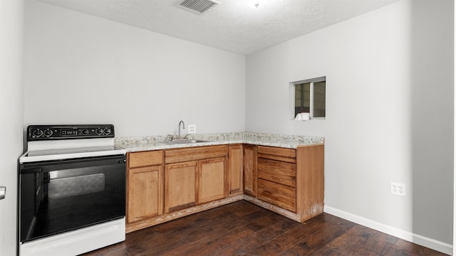 kitchen with dark hardwood / wood-style flooring, sink, electric range, and a textured ceiling