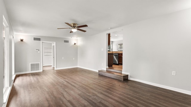 unfurnished living room with dark wood-type flooring and ceiling fan