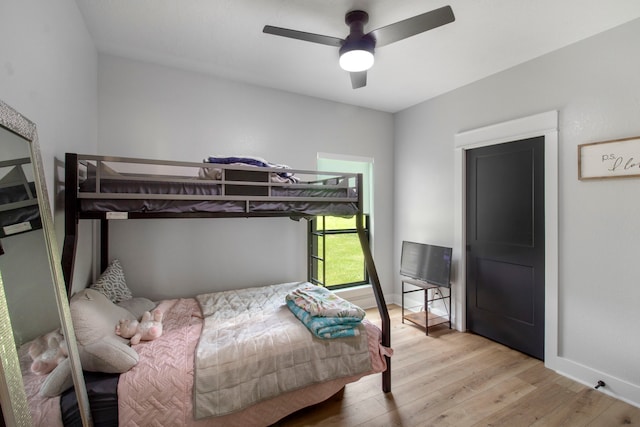 bedroom featuring ceiling fan and light hardwood / wood-style flooring