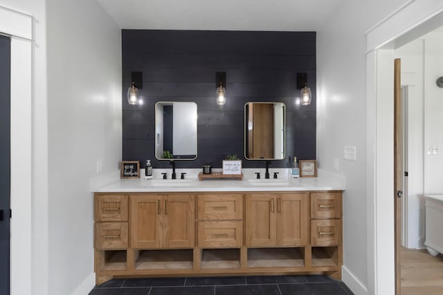 bathroom with vanity, tile patterned flooring, and wooden walls