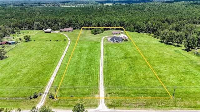 birds eye view of property with a rural view