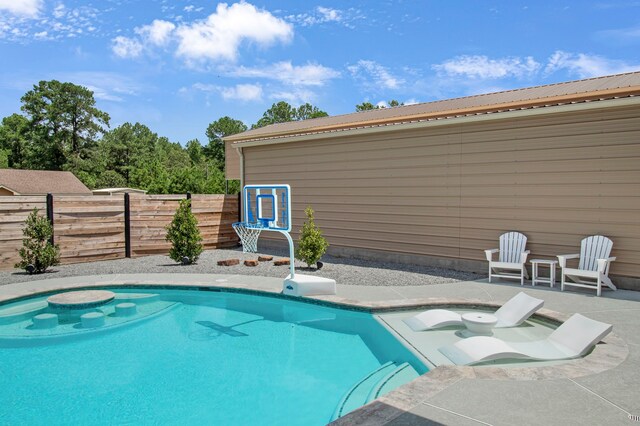 view of pool featuring a patio