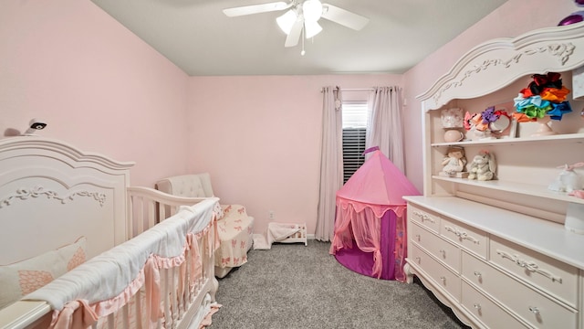 bedroom featuring carpet, a nursery area, and ceiling fan