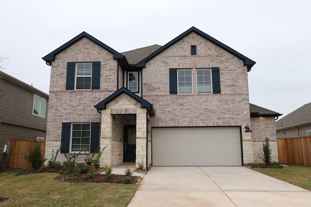 view of front facade with a garage and a front yard