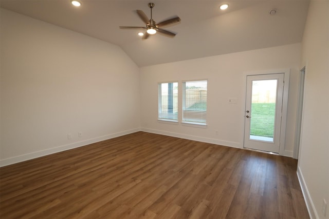 unfurnished room with dark wood-type flooring, ceiling fan, and lofted ceiling