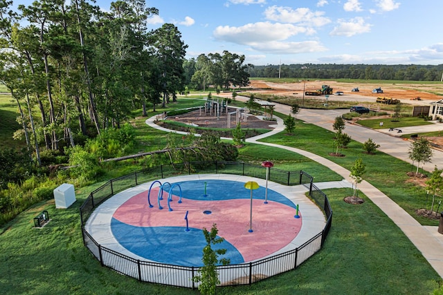 surrounding community featuring a playground and a yard