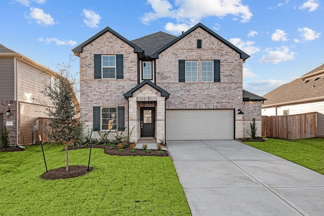 view of front facade featuring a garage and a front lawn