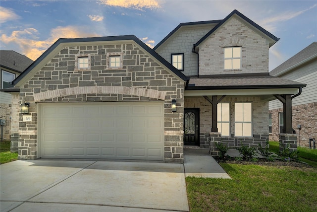 view of front of house with a garage and covered porch