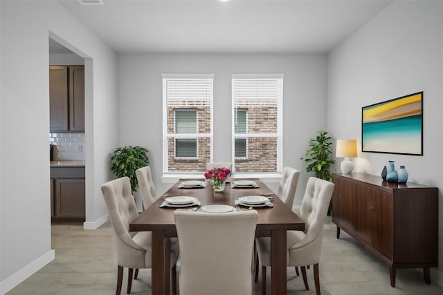 dining space featuring light hardwood / wood-style flooring