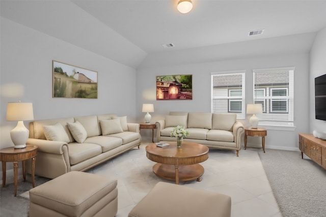 living room with vaulted ceiling and light colored carpet