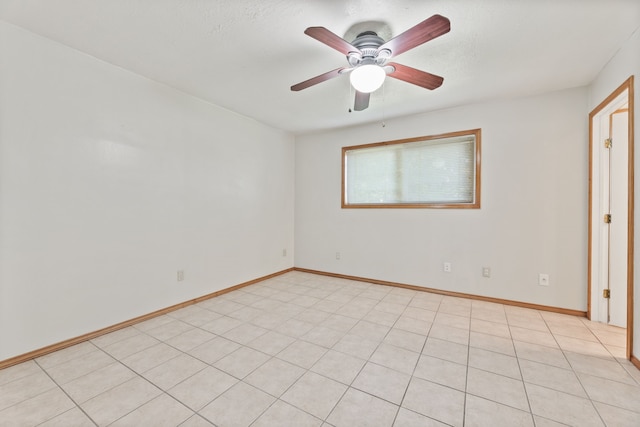 tiled empty room with ceiling fan