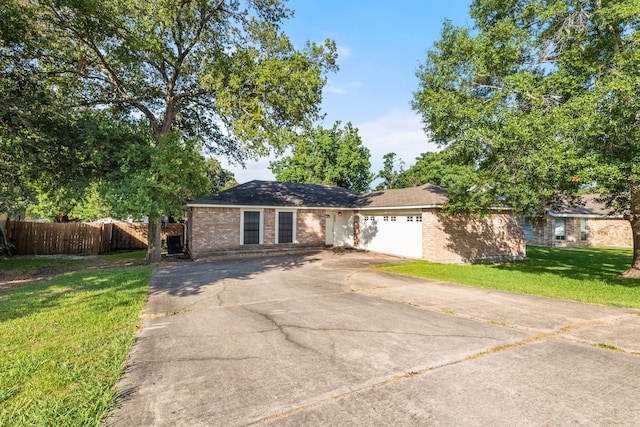 ranch-style home featuring a front yard