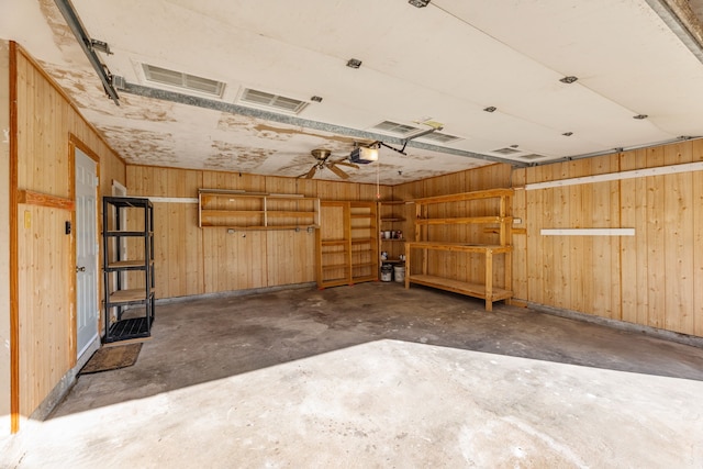 garage featuring a garage door opener and ceiling fan