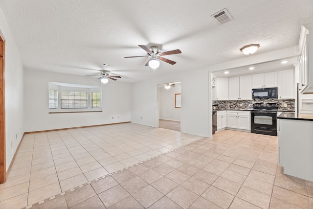 kitchen with ceiling fan, black appliances, and light tile patterned floors