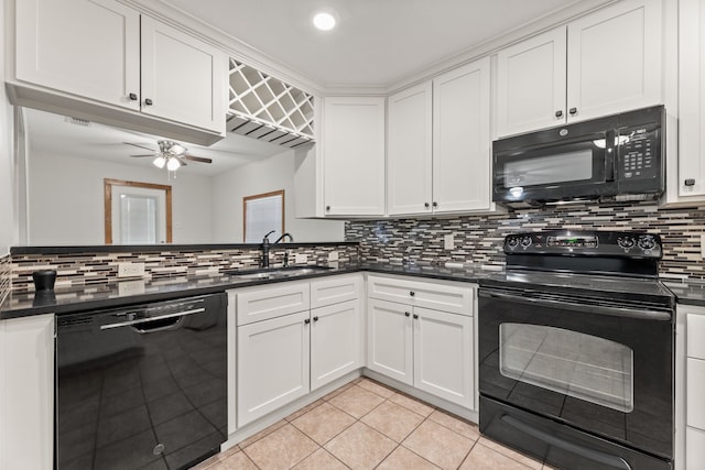 kitchen with backsplash, black appliances, sink, and ceiling fan