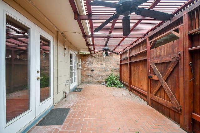 view of patio featuring ceiling fan and french doors