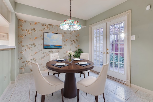 dining area with french doors and light tile patterned flooring