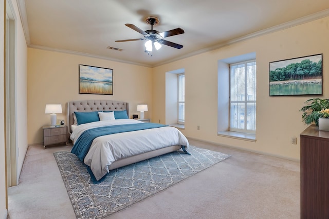 bedroom featuring light carpet, ceiling fan, and ornamental molding