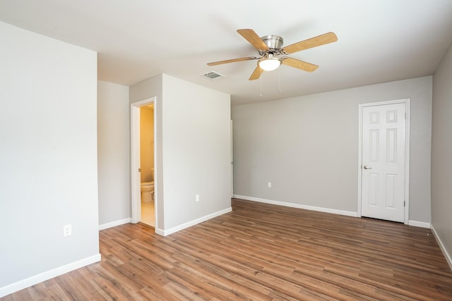 spare room with ceiling fan and hardwood / wood-style floors