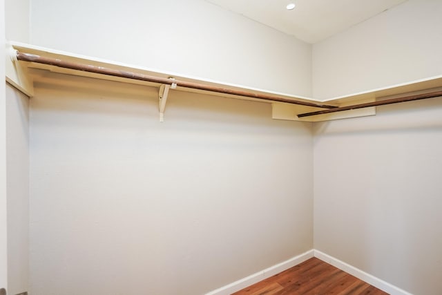 spacious closet featuring hardwood / wood-style floors