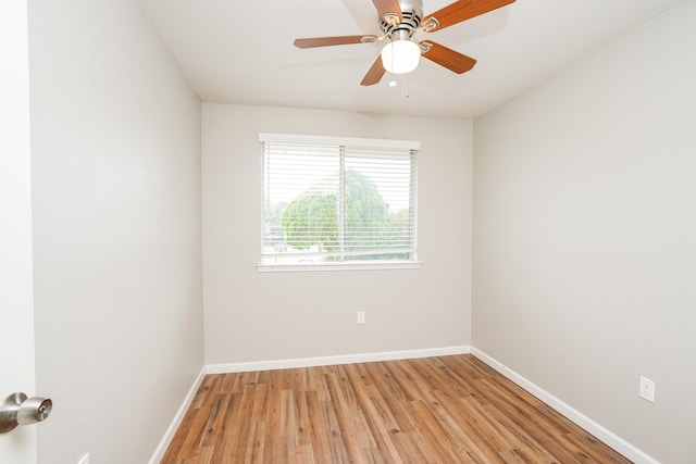 spare room featuring light wood-type flooring and ceiling fan