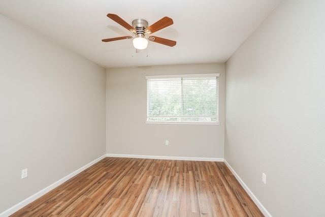 spare room featuring light hardwood / wood-style floors and ceiling fan