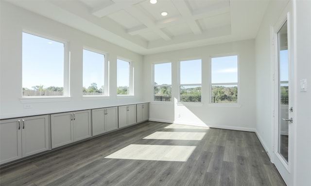 unfurnished sunroom with beam ceiling, a wealth of natural light, and coffered ceiling