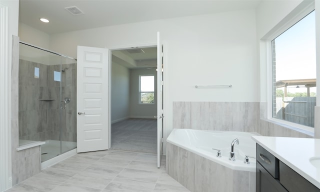 bathroom with shower with separate bathtub and vanity