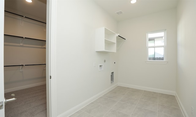 clothes washing area with hookup for an electric dryer, washer hookup, light tile patterned floors, and hookup for a gas dryer