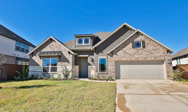 view of front of house with a garage and a front lawn