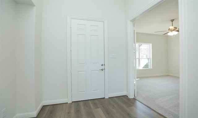 foyer entrance featuring hardwood / wood-style floors and ceiling fan