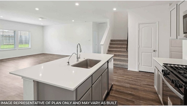 21750 Southern Valley Ln, New Caney, TX 77357 - kitchen featuring a sink, gray cabinets, dark wood finished floors, stainless steel appliances, and recessed lighting